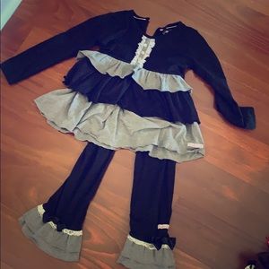 Ruffle Butts grey and black outfit.